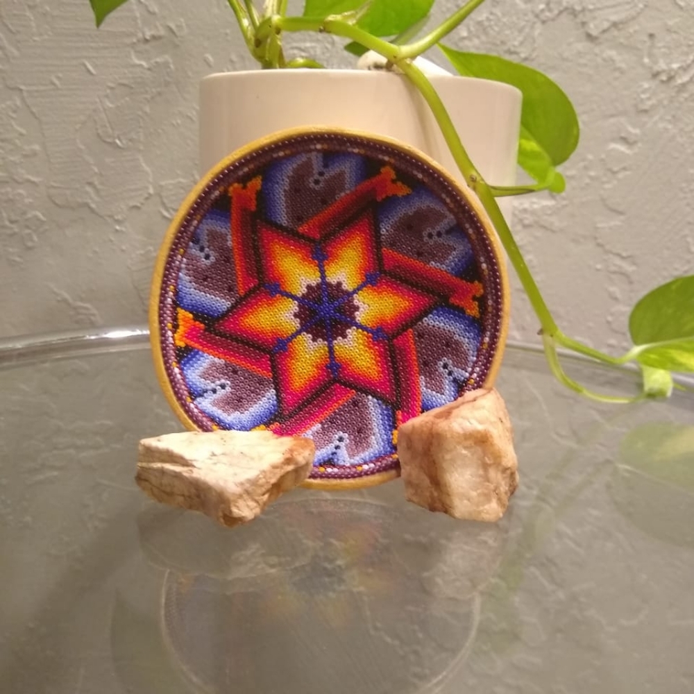 This is a wooden bowl with beads